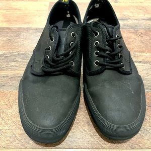 Dr. Martens black leather skate shoe.